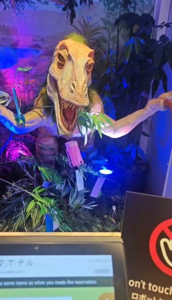 ANIMATRONIC DINASOUR RECEPTIONIST ROBOT AT HENN NA HOTEL , CHECK IN COUNTER 